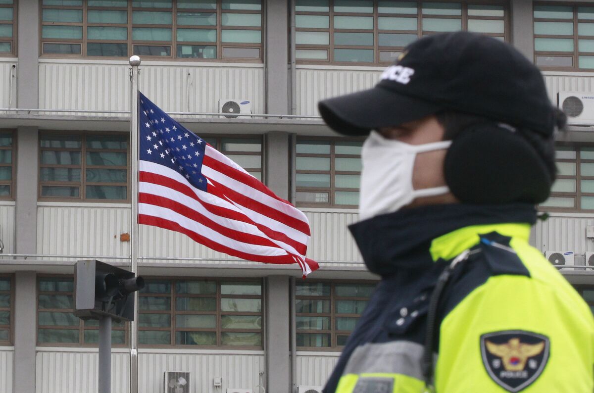 FILE - the U.S. Flag flies near the U.S. Embassy in Seoul, South Korea, Thursday, March 5, 2015. South Korean police said Thursday, Nov. 11, 2021, they’re pushing to investigate a U.S. diplomat to find if he intentionally fled following a traffic accident in Seoul. (AP Photo/Ahn Young-joon, File)