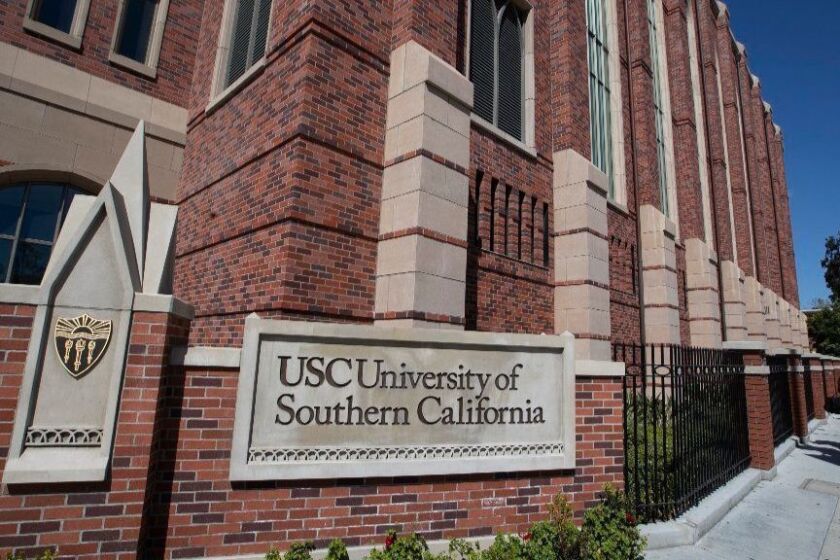LOS ANGELES, CALIF. -- TUESDAY, MARCH 12, 2019: A view of people visiting the University of Southern California in Los Angeles, Calif., on March 12, 2019. Federal prosecutors say their investigation dubbed Operation Varsity Blues blows the lid off an audacious college admissions fraud scheme aimed at getting the children of the rich and powerful into elite universities. According to prosecutors, wealthy parents paid a firm to help their children cheat on college entrance exams and falsify athletic records of students to enable them to secure admission to schools such as UCLA, USC, Stanford, Yale and Georgetown. Two USC athletic department employees — a high-ranking administrator and a legendary head coach — were fired Tuesday after being indicted in federal court in Massachusetts for their alleged roles in a racketeering conspiracy that helped students get into elite colleges and universities by falsely designating them as recruited athletes. (Allen J. Schaben / Los Angeles Times)
