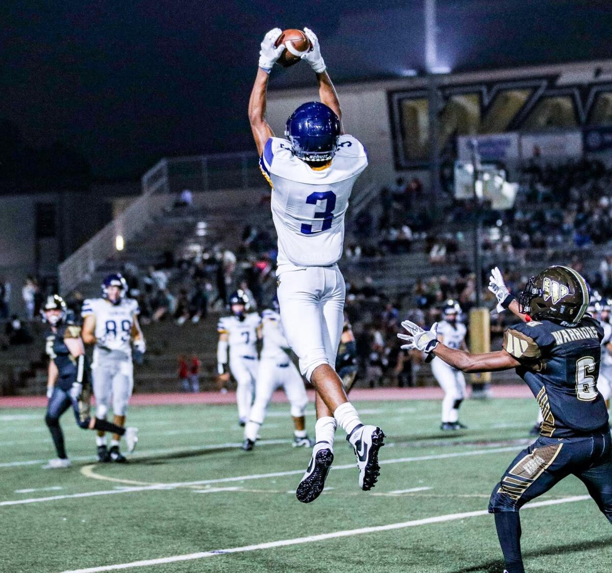 Charles Cravings of Santa Monica makes a catch against West Torrance. He had three interceptions.