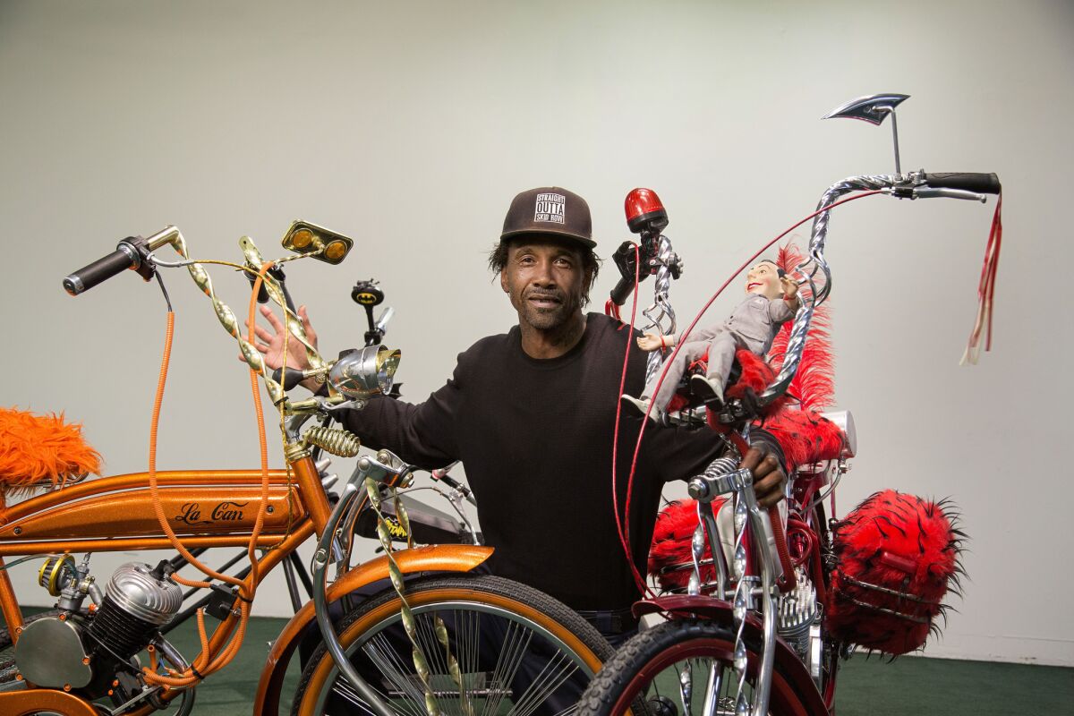 The activist known as General Dogon poses with his custom bikes at the Skid Row History Museum and Archive in downtown Los Angeles. The bikes are on display as part of a series of exhibitions that will chronicle the history of Skid Row.