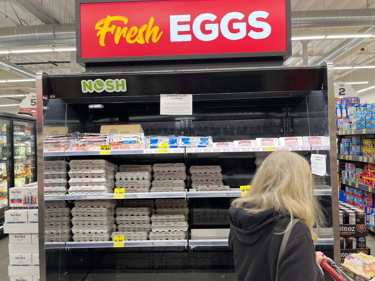 A customer looks over the egg selection at a market in Redondo Beach on Jan. 5. 