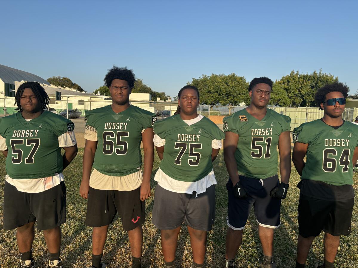 Dorsey's big offensive line features, from left, Chris Barnett, King Jackson, Derek Armstrong, Mike McDonald, Alonzo Holmes.