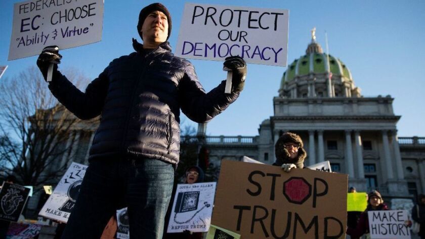 Protesters demonstrate ahead of Pennsylvania's electoral college vote at the state Capitol in Harrisburg on Dec. 19, 2016.