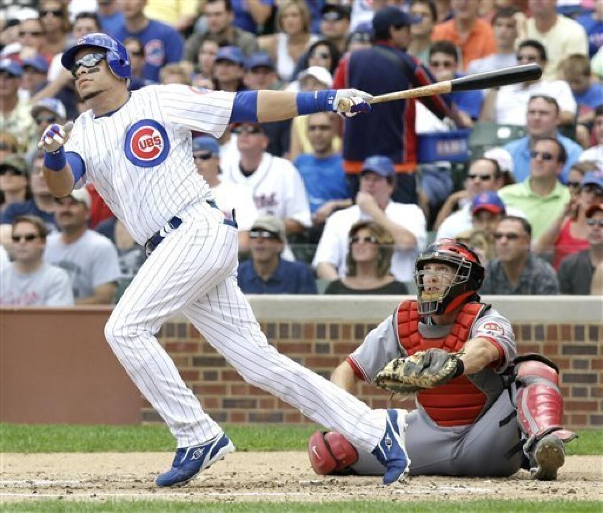 Harden pitches Cubs past Cincinnati, back into first place