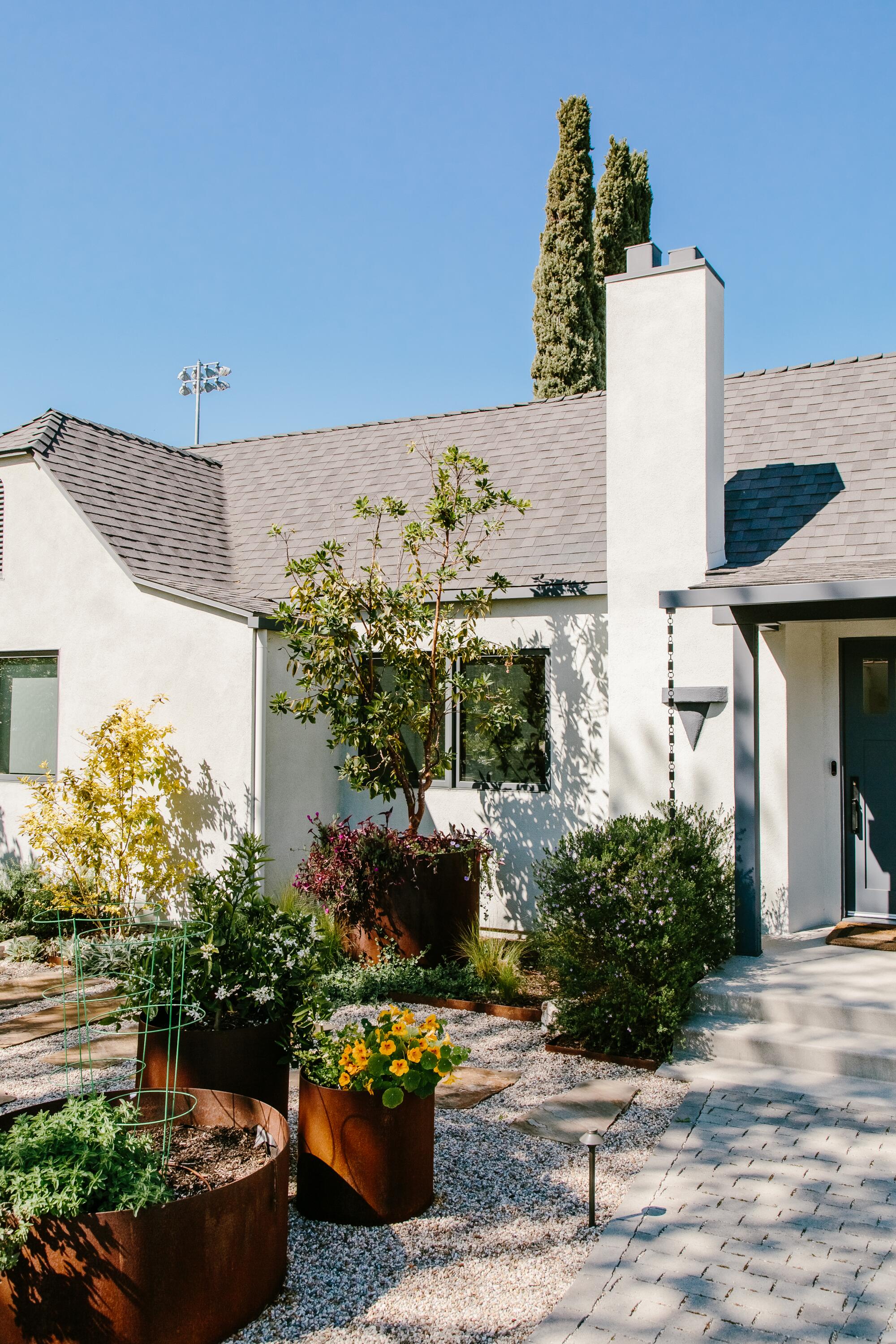 A white bungalow and front yard 