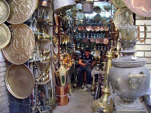 Copper plaques and plates hang at the Safafeer market in Baghdad. For hundreds of years, the copper market has been considered hallowed ground. But these days, few people come to buy.
