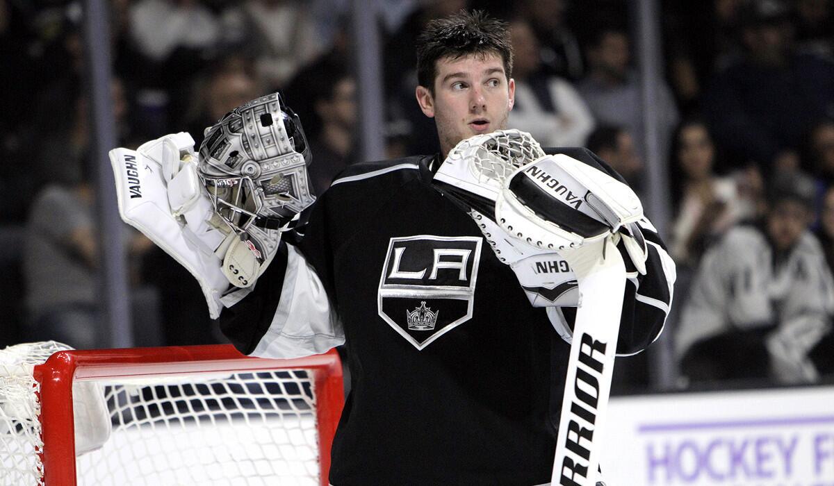 Kings goalie Jonathan Quick catches his breath during a break in the action against the Sabres on Thursday night at Staples Center.