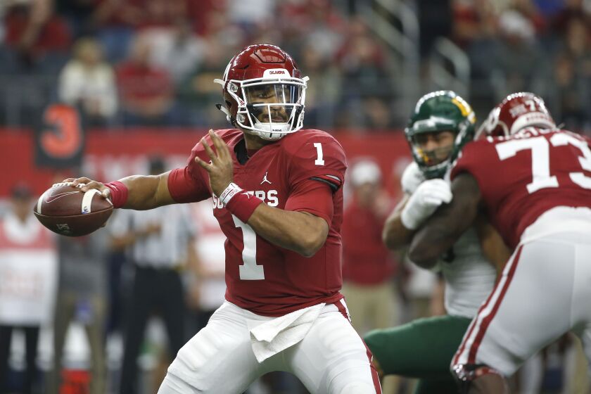 ARLINGTON, TX - DECEMBER 07: Jalen Hurts #1 of the Oklahoma Sooners looks to pass the ball against the Baylor Bears in the first quarter of the Big 12 Football Championship at AT&T Stadium on December 7, 2019 in Arlington, Texas. (Photo by Ron Jenkins/Getty Images) ** OUTS - ELSENT, FPG, CM - OUTS * NM, PH, VA if sourced by CT, LA or MoD **