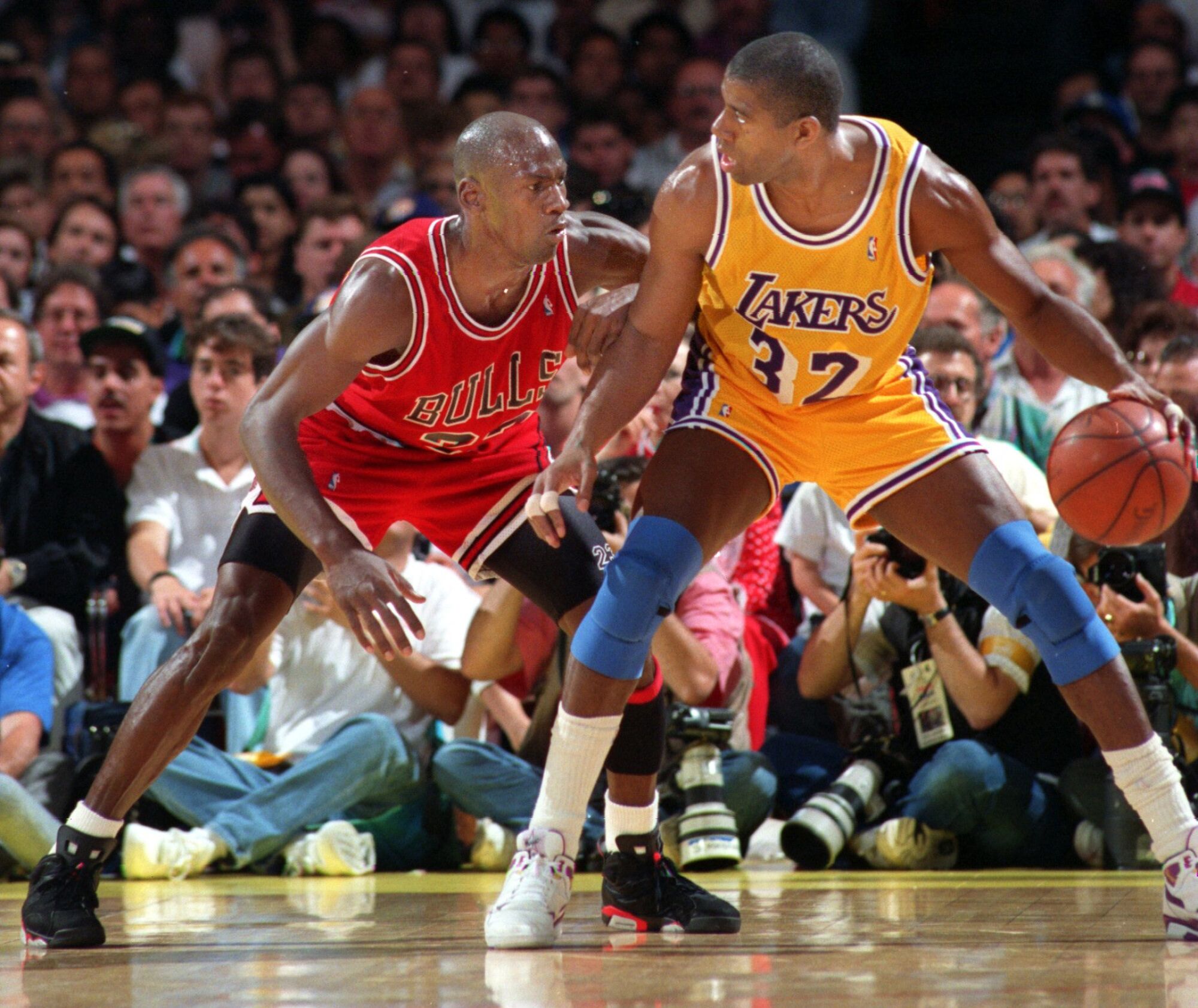 Magic Johnson tries to move past Michael Jordan during the 1991 NBA Finals