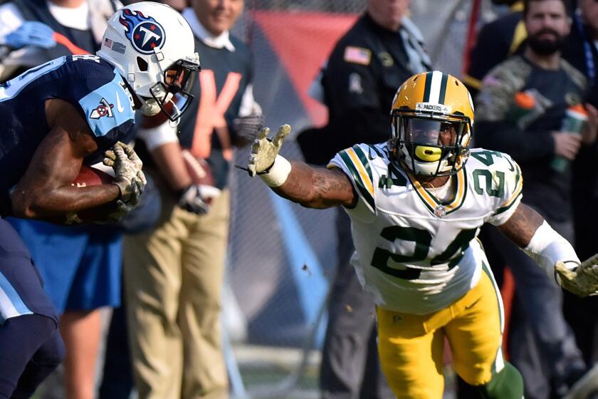 Packers cornerback Quinten Rollins dives to try to break up a touchdown pass to titans receiver Tajae Sharpe during a game Nov. 13.