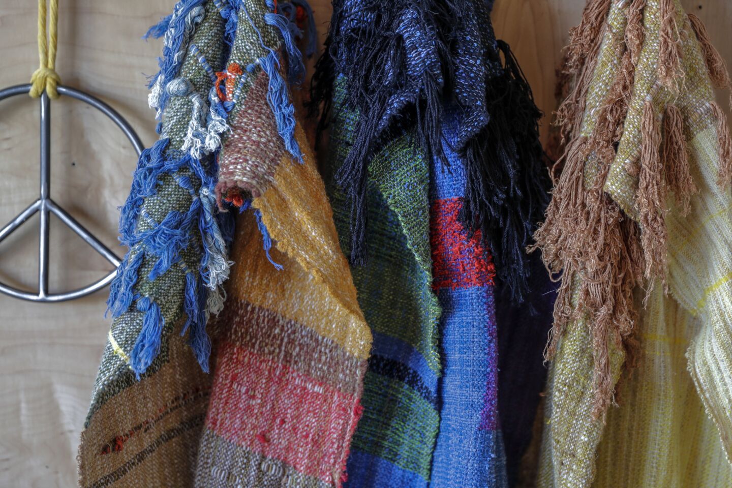 Handwoven color block scarves for sale at the All Roads store.