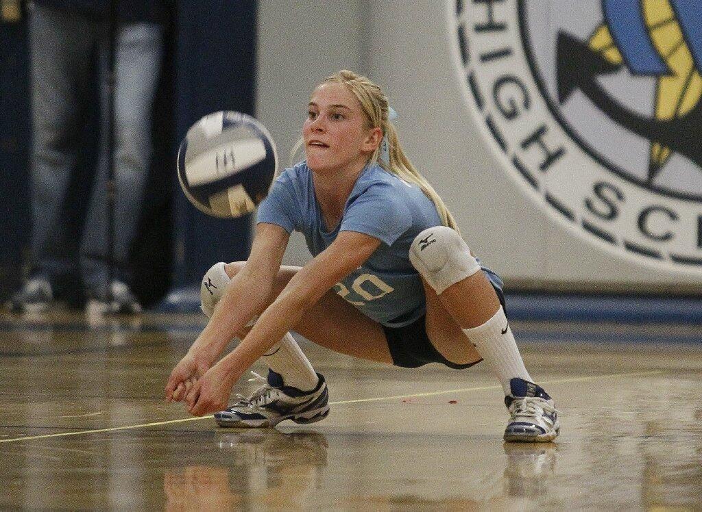 Corona del Mar High's Payton Carter passes a ball during the Battle of the Bay girls' volleyball match against Newport Harbor on Saturday.
