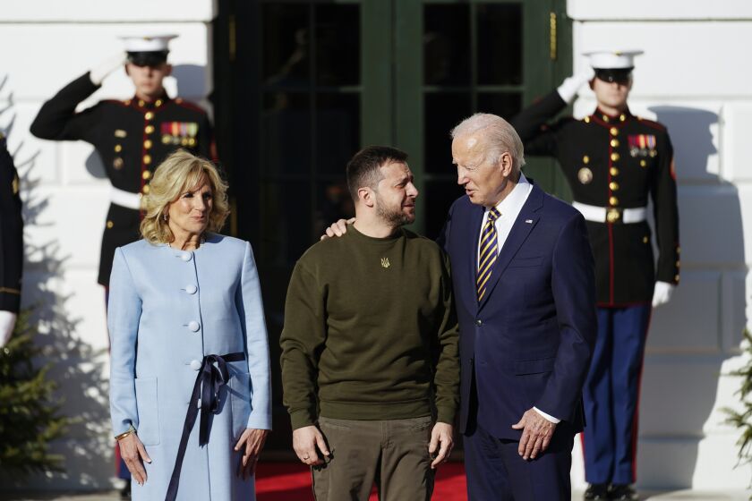 FILE - President Joe Biden welcomes Ukraine's President Volodymyr Zelenskyy at the White House in Washington, Wednesday, Dec. 21, 2022. A year ago, with Russian forces bearing down on Ukraine’s capital, Western leaders feared for the life of President Volodymyr Zelenskyy and the U.S. offered him an escape route. Zelenskyy declined, declaring his intent to stay and defend Ukraine’s independence. (AP Photo/Andrew Harnik, File)