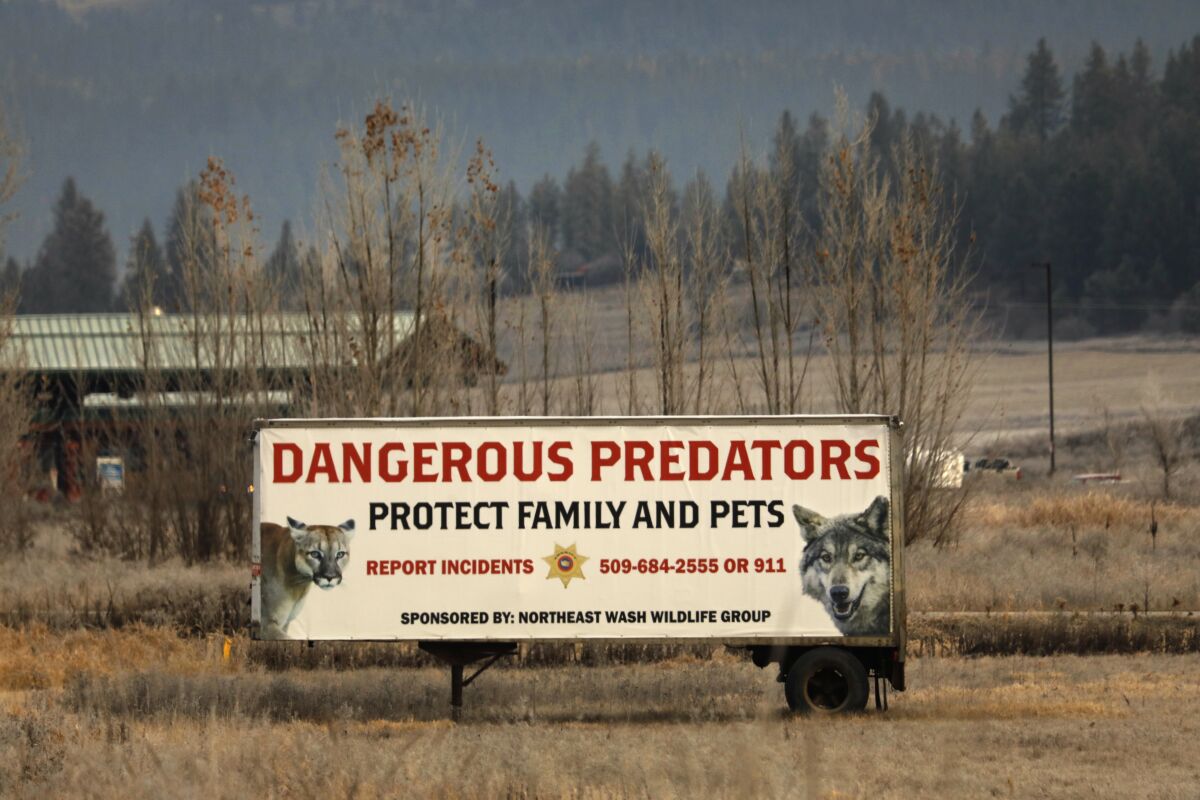 A billboard south of Colville, Wash., warns of area predators. 