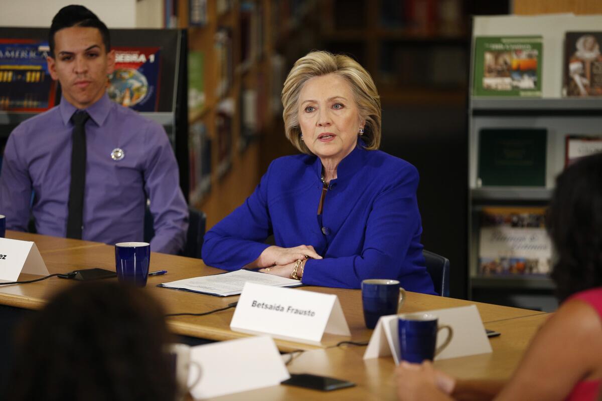 Hillary Rodham Clinton, seen here with a group of high school students in Las Vegas on May 5, has been courting wealthy donors through the super PAC Priorities USA Action.