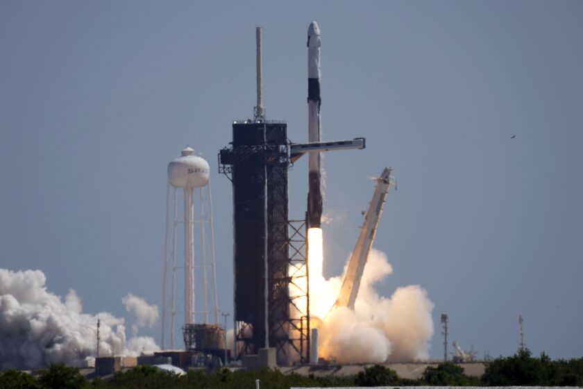 A SpaceX Falcon 9 rocket with the Crew Dragon capsule attached, lifts off with the first private crew from Launch Complex 39A Friday, April 8, 2022, at the Kennedy Space Center in Cape Canaveral, Fla. . (AP Photo/Chris O'Meara)