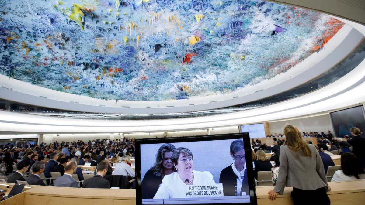United Nations human rights chief Michelle Bachelet is shown on a screen as she addresses the 39th session of the Human Rights Council on Sept. 10, 2018.