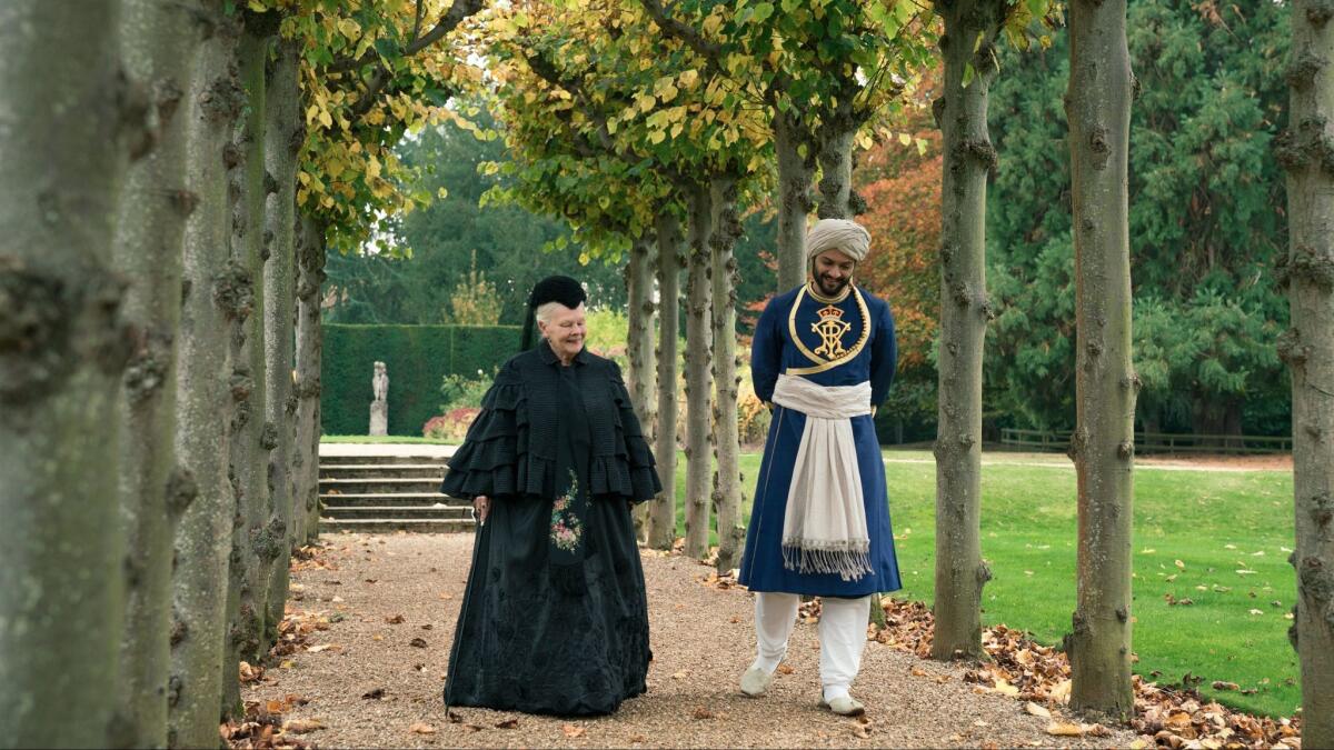 Judi Dench as Queen Victoria and Ali Fazal as Abdul Karim, the servant she befriends, in director Stephen Frears' "Victoria & Abdul." (Peter Mountain / Focus Features)