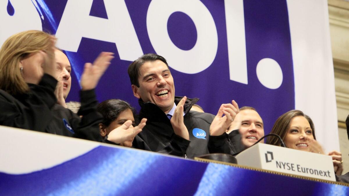 Then-Chairman and CEO Tim Armstrong of AOL, center, at the New York Stock Exchange in 2009. AOL's acquisition by Verizon in 2015 didn't make all its shareholders happy.