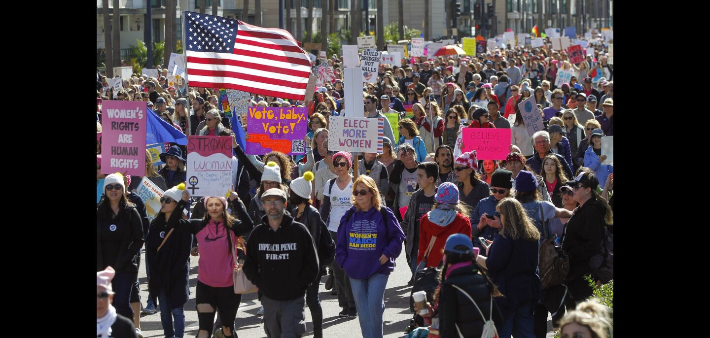 People walk north on Pacific Highway during the San Diego Women's March.