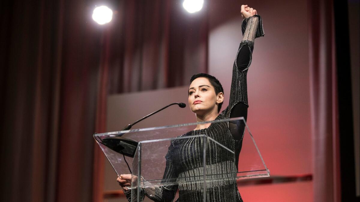 Rose McGowan raises her fist as she speaks during The Women's Convention at Cobo Center in downtown Detroit, Friday, Oct. 27, 2017. (Junfu Han/Detroit Free Press/TNS via Getty Images)