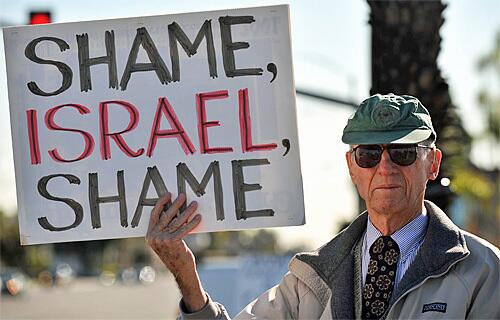 Man holds placard in Anaheim
