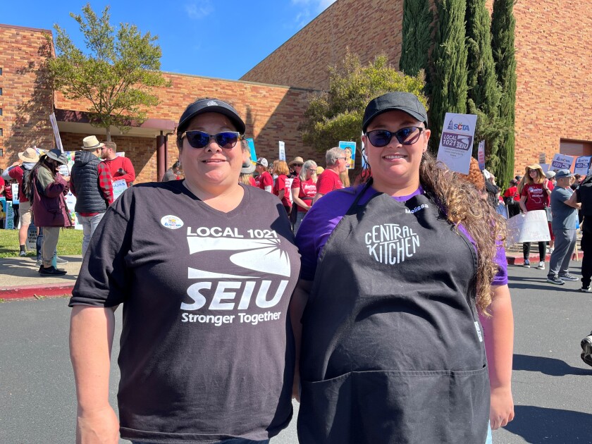 Two women standing side by side.