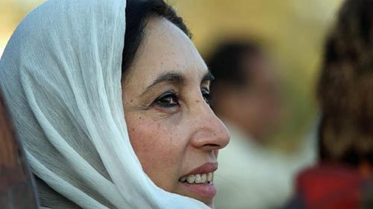 Minutes before her death, former Pakistani Prime Minister Benazir Bhutto gazes towards a crowd of thousands of supporters at a campaign rally.