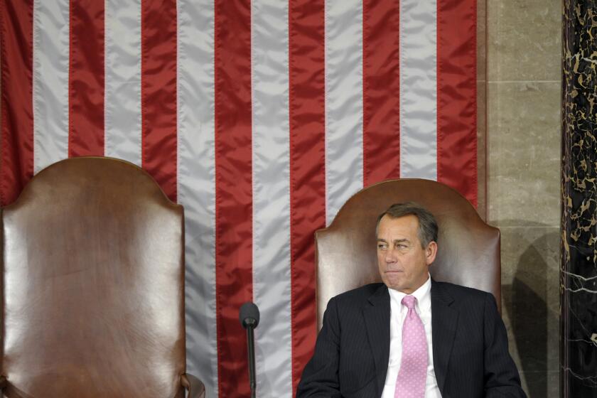 House Speaker John Boehner of Ohio waits for the start of a Joint Session of Congress in the House Chamber on Capitol Hill to count the Electoral College votes.