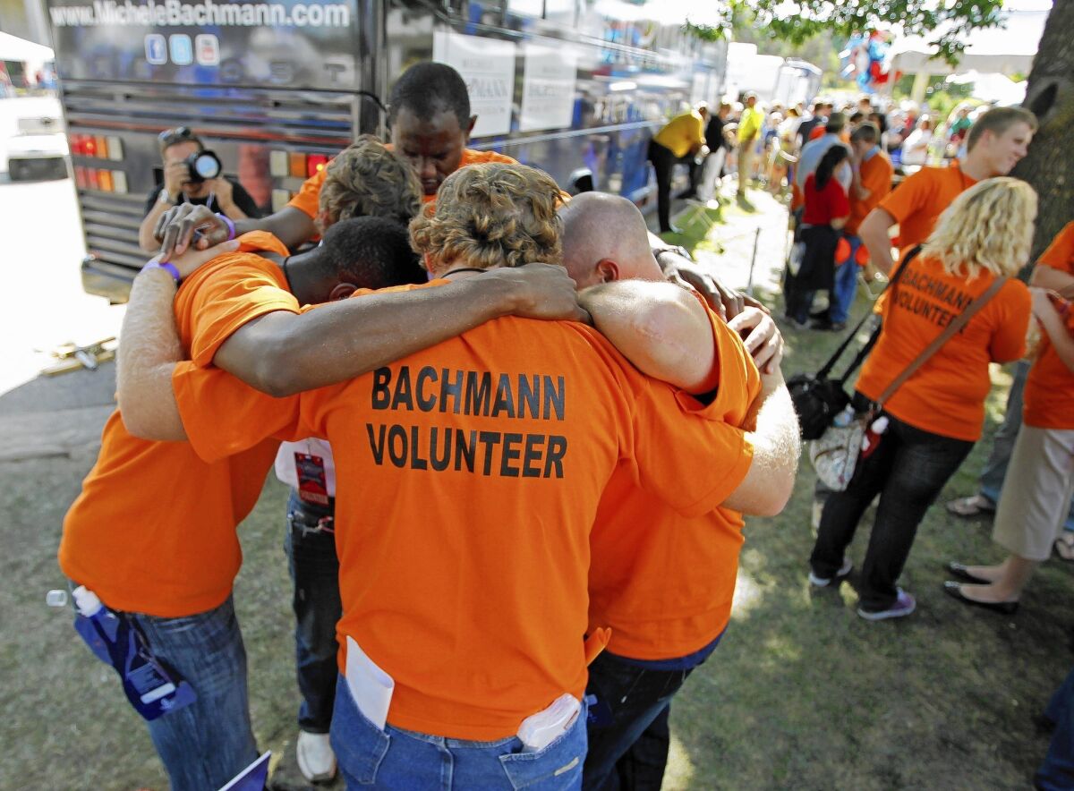 Campaign workers for Rep. Michele Bachmann huddle at the GOP's 2011 Ames straw poll, which she won. Five months later, after finishing sixth in Iowa's caucuses, Bachmann exited the presidential race.