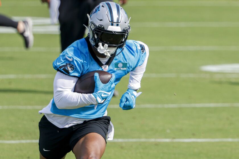 FILE- Carolina Panthers running back Miles Sanders runs after a catch during NFL football practices in Charlotte, N.C., Monday, May 22, 2023. Sanders joined the Panthers as a free agent this offseason, signing a four-year, $25 million contract helping Carolina offset the loss of Christian McCaffrey, who was traded away early last season as the team was in the midst of a roster makeover. (AP Photo/Nell Redmond)