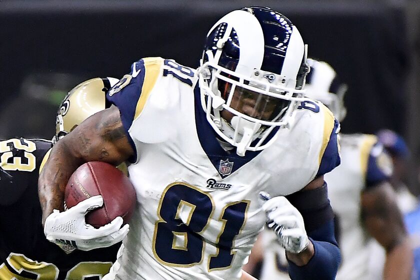 NEW ORLEANS. LOUISIANA JANUARY 20, 2018-Rams tight end Gerald Everett picsk up yards against the Saints in the 4th quarter in the NFC Championship at the Superdome in New Orleans Sunday. (Wally Skalij/Los Angeles Times)