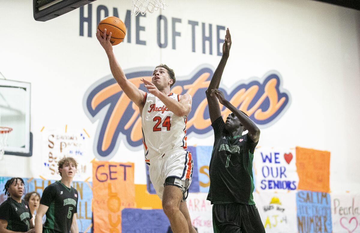 Pacifica Christian Orange County's Alex Stewart goes up for a shot against Fairmont Prep's Maper Maker during Friday's game.