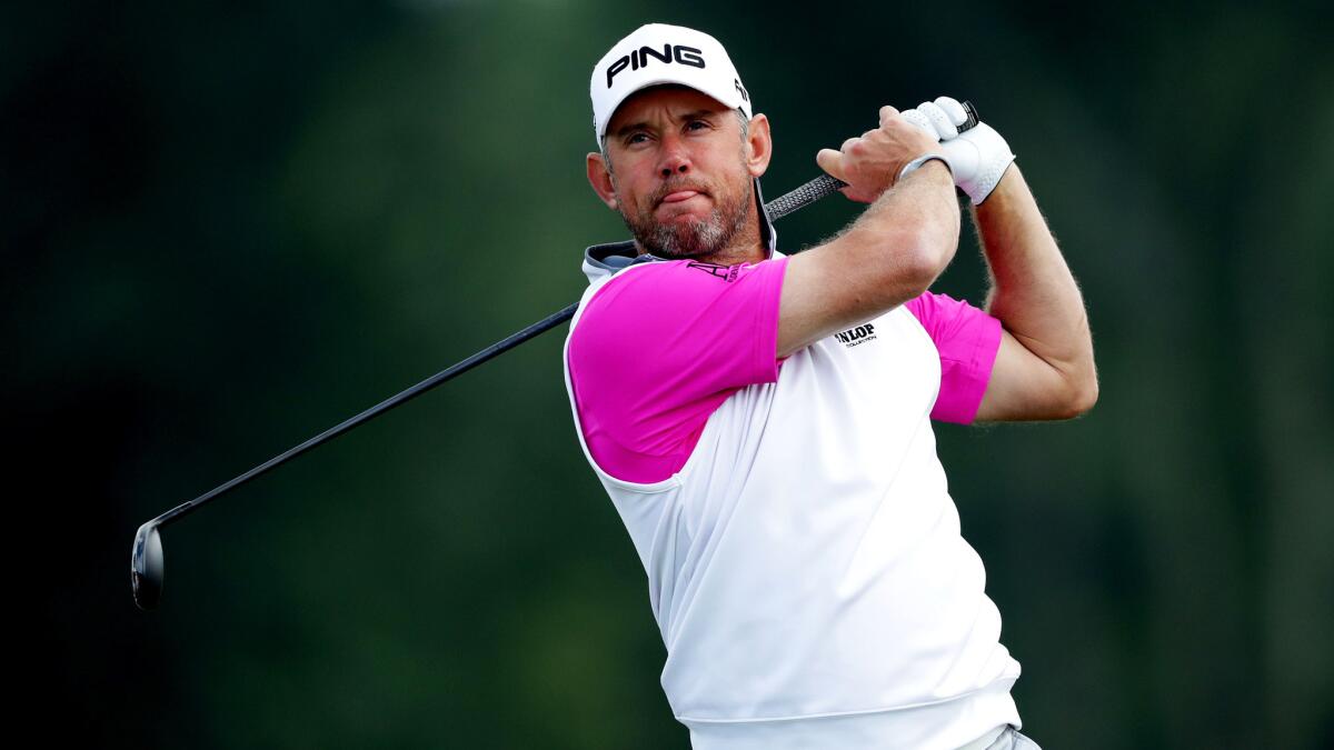 Lee Westwood tees off at No. 8 during the continuation of the first round at the U.S. Open on Friday.