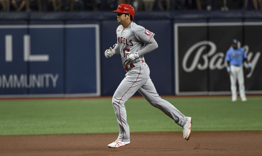 Angels designated hitter Shohei Ohtani circles the bases after hitting a solo home run in the first inning Friday.