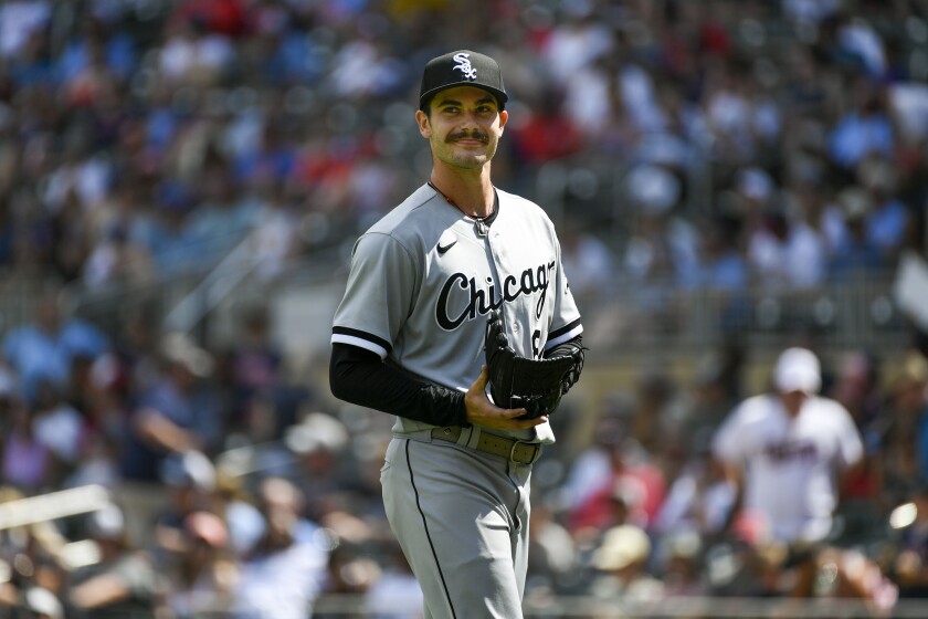 Chicago White Sox pitcher Dylan Cease smiles as he heads to the dugout after finishing the seventh inning allowing one hit against the Minnesota Twins during a baseball game, Sunday, July 17, 2022, in Minneapolis. (AP Photo/Craig Lassig)