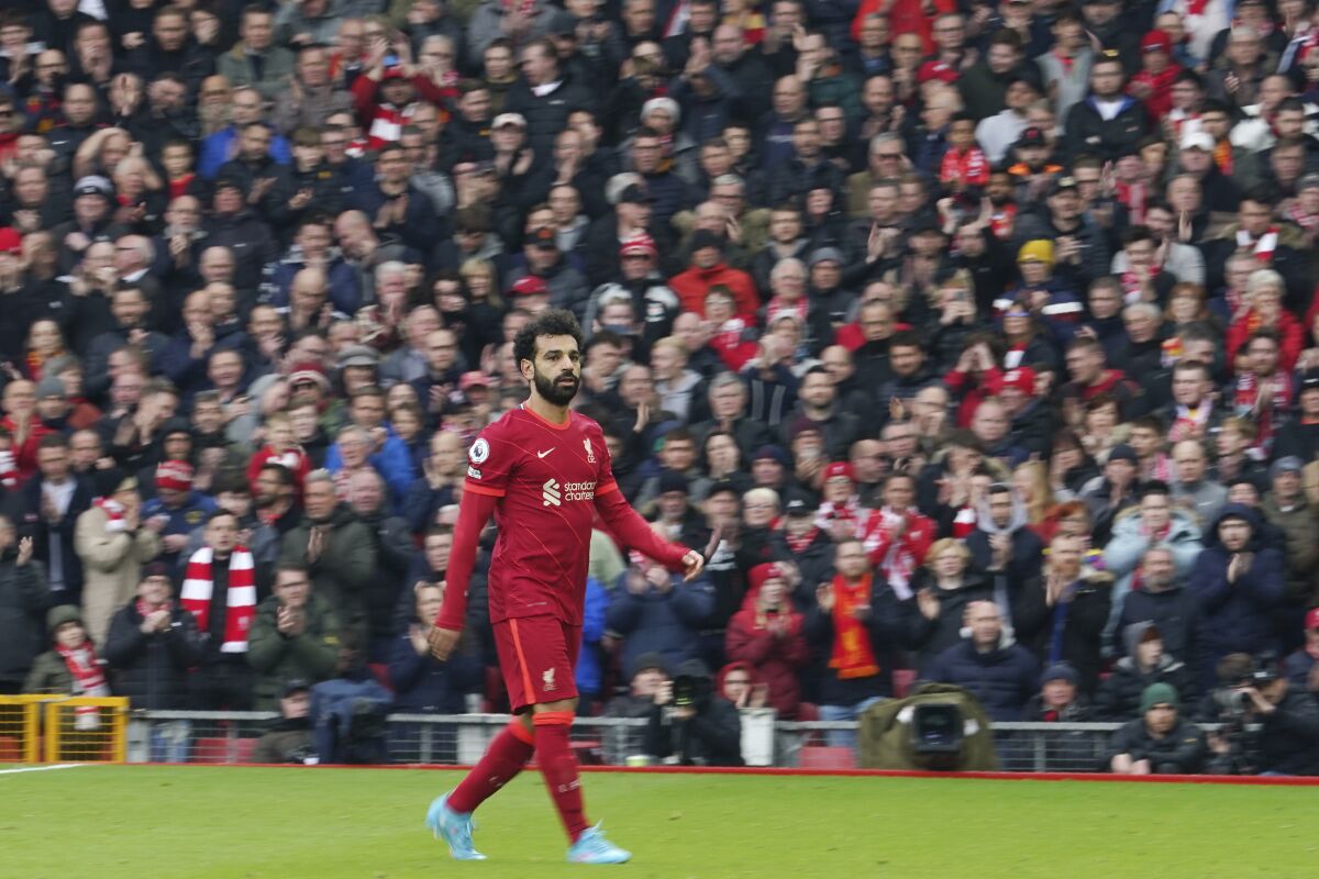 Liverpool's Mohamed Salah leaves the field during the English Premier League soccer match between Liverpool and Watford at Anfield stadium in Liverpool, England, Saturday, April 2, 2022. (AP Photo/Jon Super)