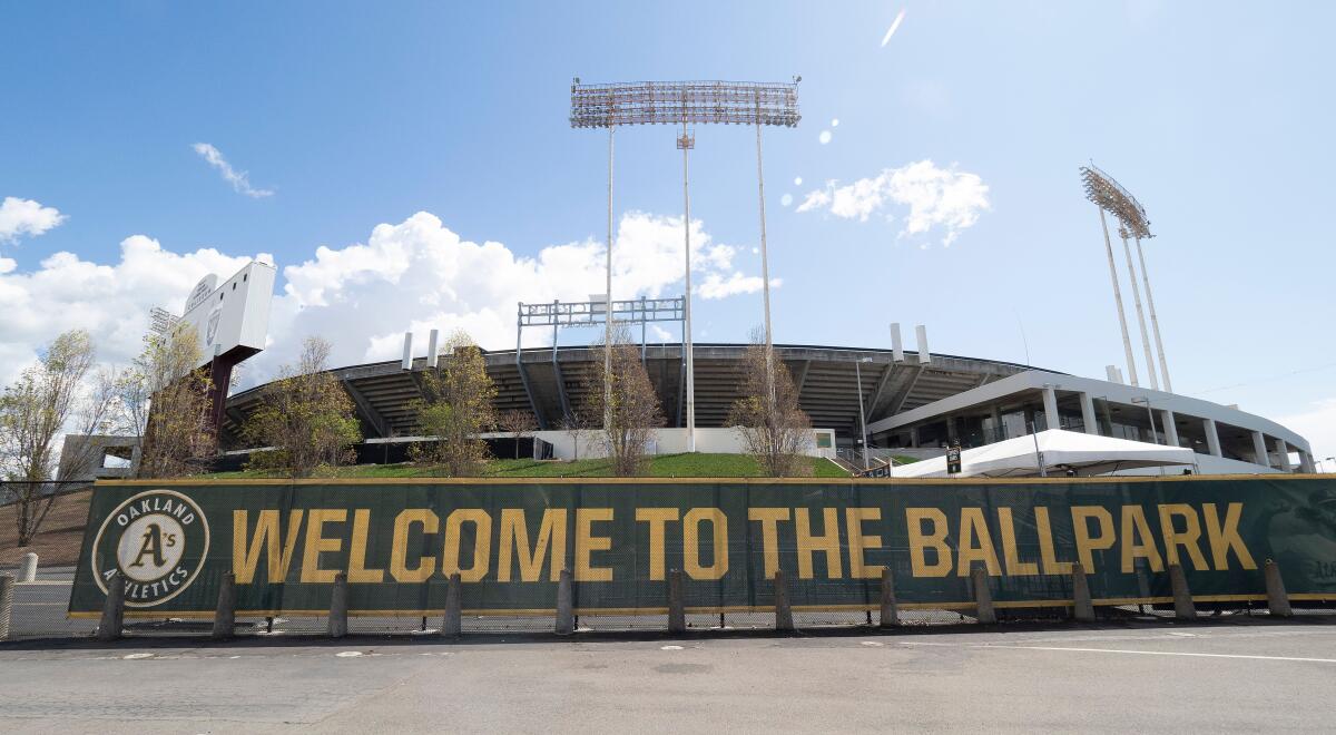 A banner in front of a baseball stadium reads "Welcome to the ballpark."