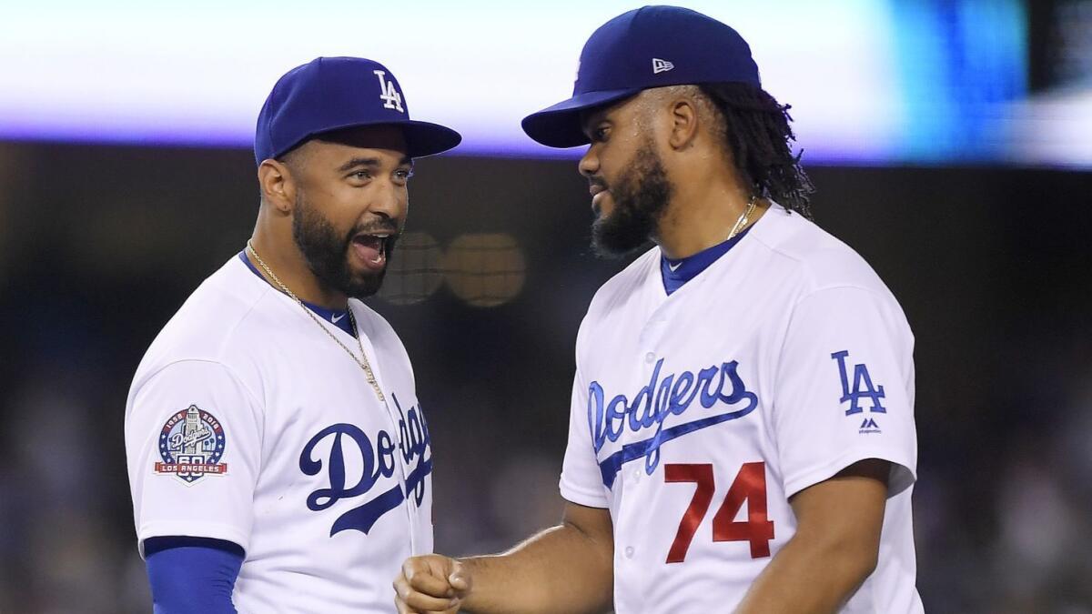 Matt Kemp, left, congratulates Dodgers closer Kenley Jansen after a 3-2 win over the San Francisco Giants on June 15.