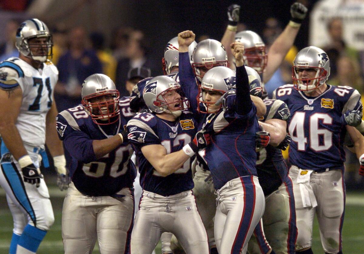 Patriots kicker Adam Vinatieri celebrates after kicking a 41-yard field goal in the fourth quarter to beat the Panthers in Super Bowl XXXVIII.