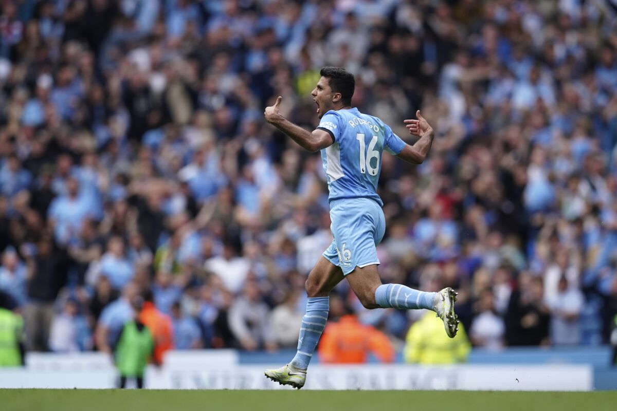 Rodrigo of Manchester City runs and screams after a goal.