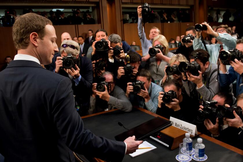 Facebook founder and CEO Mark Zuckerberg arrives to testify during a Senate Commerce, Science and Transportation Committee and Senate Judiciary Committee joint hearing about Facebook on Capitol Hill in Washington, DC, April 10, 2018. / AFP PHOTO / SAUL LOEB (Photo credit should read SAUL LOEB/AFP/Getty Images)