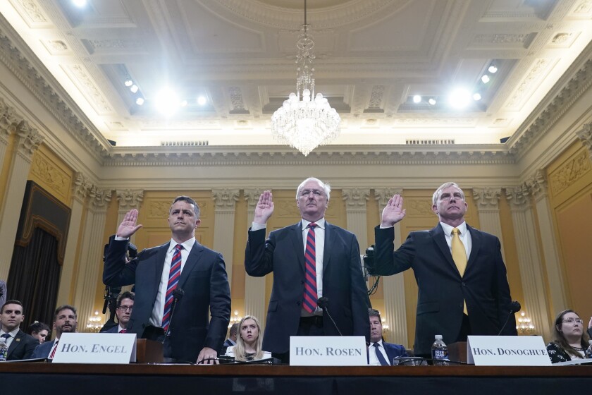 Three Justice Department staffers being sworn in together