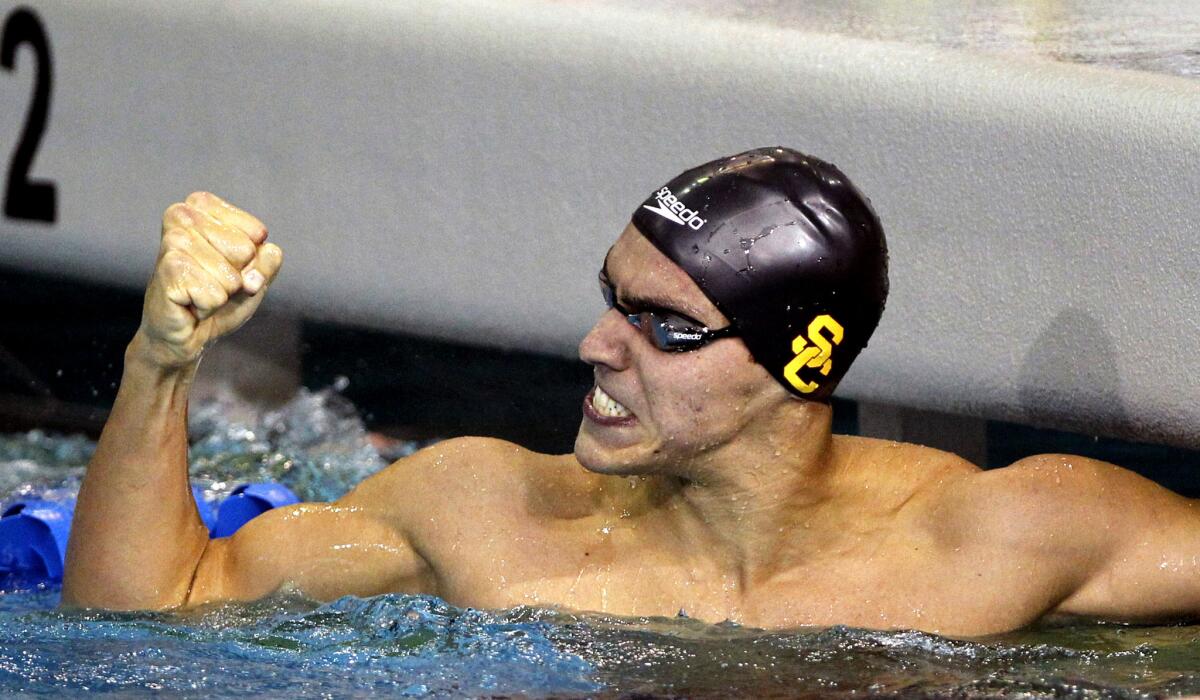 USC's Cristian Quintero, celebrating a win in the men's 500-yard freestyle at last year's NCAA swimming championships, will compete in three individual and three relay events this year.
