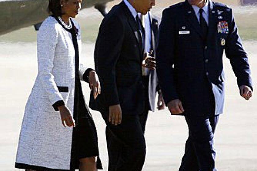 Mrs. Obama took off for the 2009 G-20 summit in London wearing an ivory tulle tweed coat with black grosgrain piping made especially for her by young New York designer Thakoon Panichgul, reports Los Angeles Times fashion critic Booth Moore.