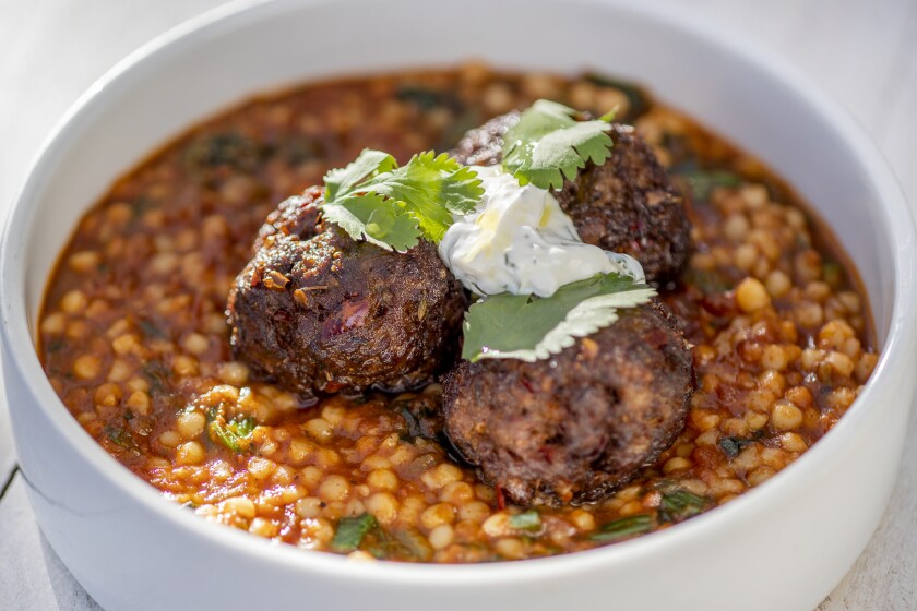Lamb meatballs are served with M'hamsa stew and labneh at Barsha.
