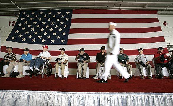 Marine veterans who fought in the battle of Peleliu, one of the bloodiest of the war, are honored aboard the Navy ship Peleliu in San Diego.