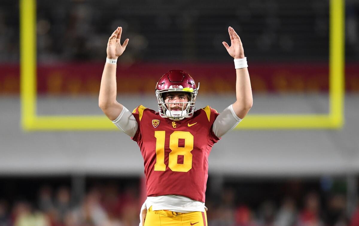 USC quarterback J.T. Daniels signals touchdown on a catch by Michael Pittman Jr. against Washington State last season.