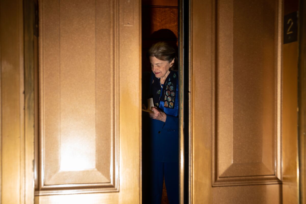 California Sen. Dianne Feinstein leaves the chamber following a vote