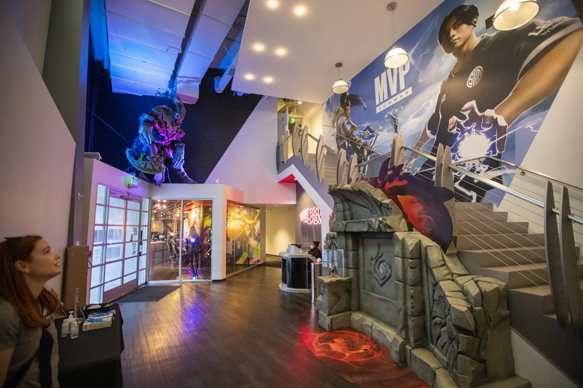 Kaitlin Stewart of Riot Games views a 13-foot puppet of Thresh, a "League of Legends" character